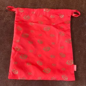 Ipsy red and gold kiss makeup drawstring bag